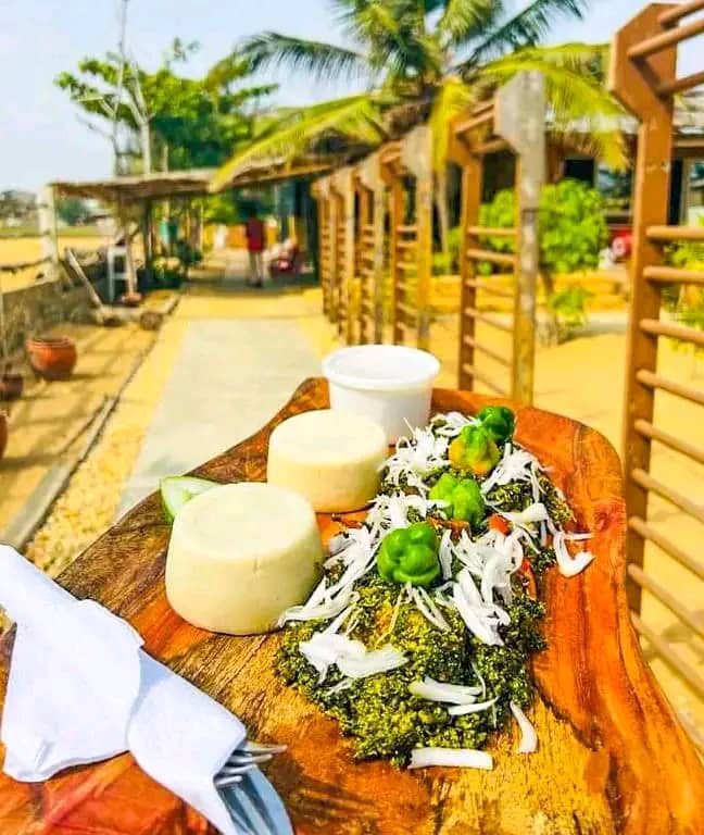 Interior of a building with columns and flags